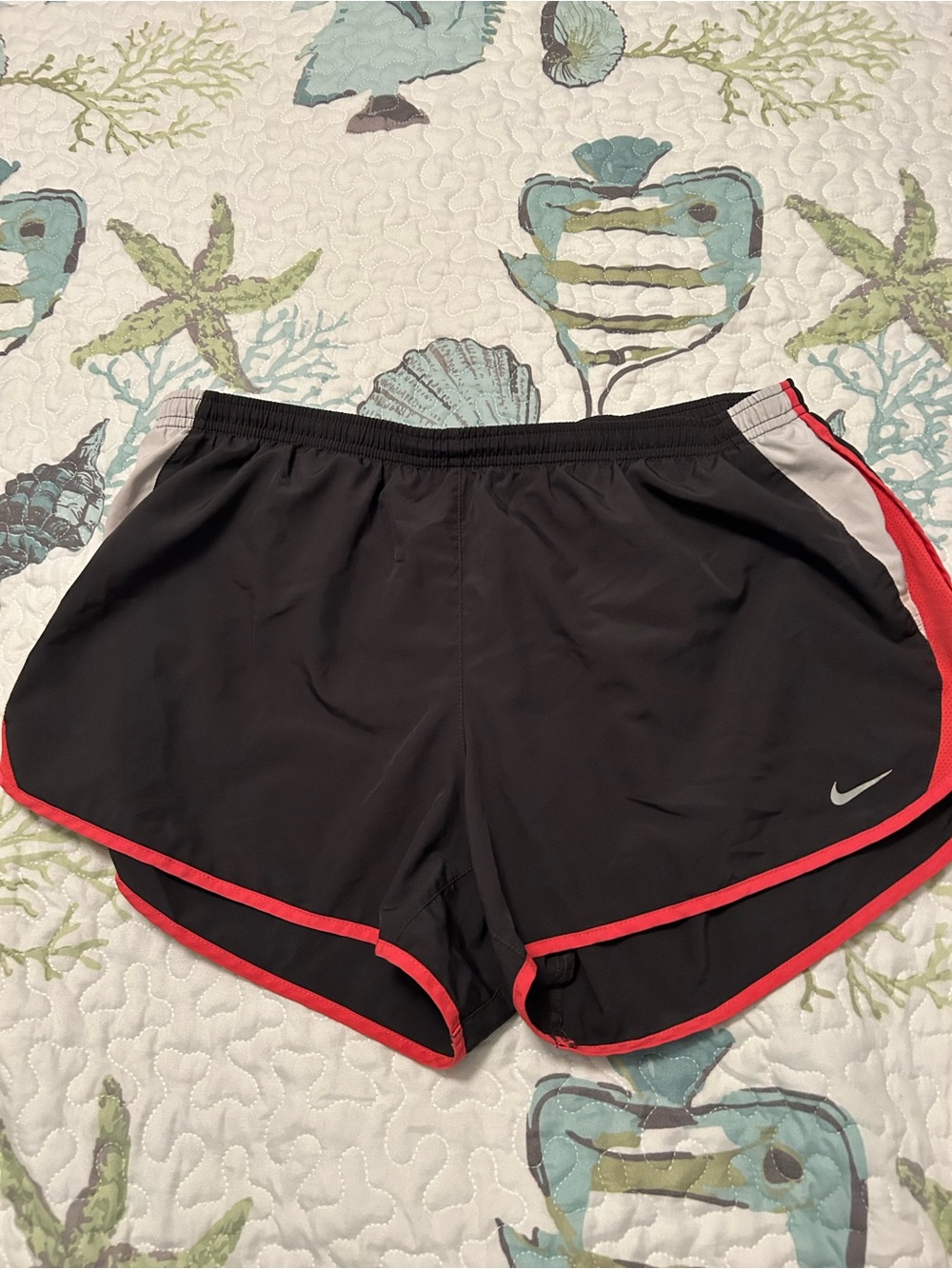 Nike Women’s Black Athletic Shorts with Red Trim and White Accent